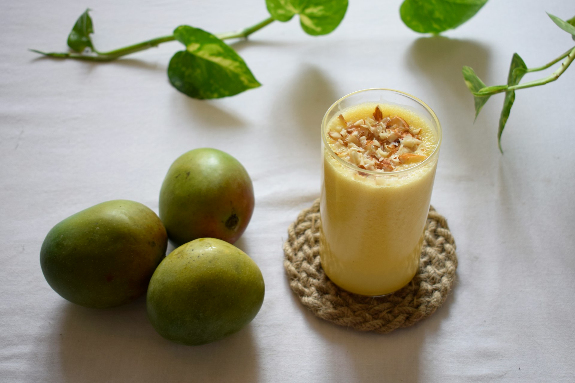 green apple beside clear drinking glass with milk